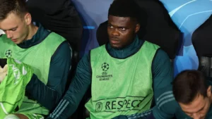 Thomas Partey watches from the bench as Arsenal lose to Bayern to crash out of UCL